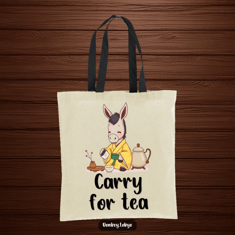Funny donkey in a yellow kimono gently pouring tea, on a stylish tote bag for humorous carrying of peaceful items.