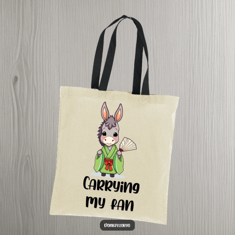 Funny donkey in a green kimono holding a fan, showcased on a stylish tote bag, offering humorous utility.
